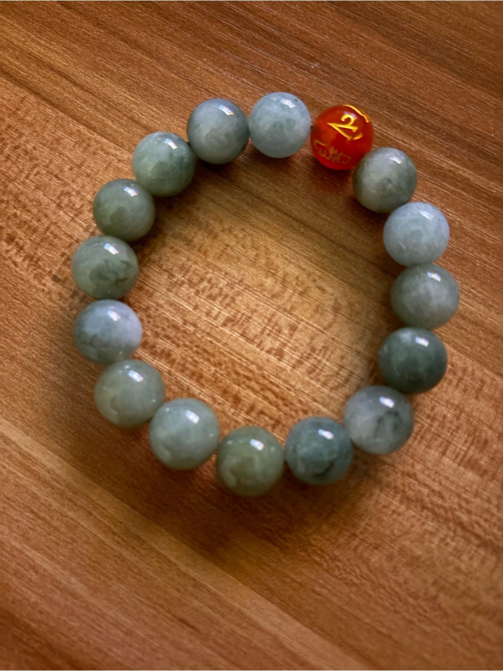 Jade bracelet with beads and red accent